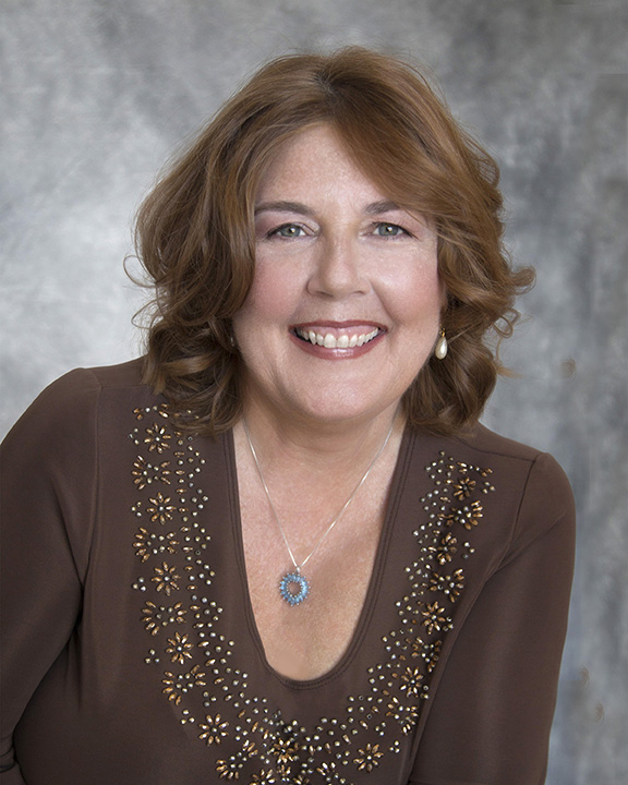 Professional headshot of Deb, Janet Joyner Photography